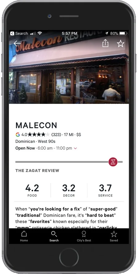 Phone screen showing a restaurant detail page with photos, Zagat scores and the review